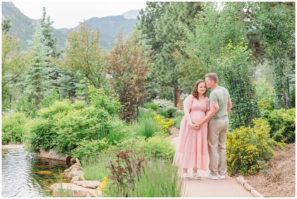 Couple pose for Stanley Hotel Maternity Session