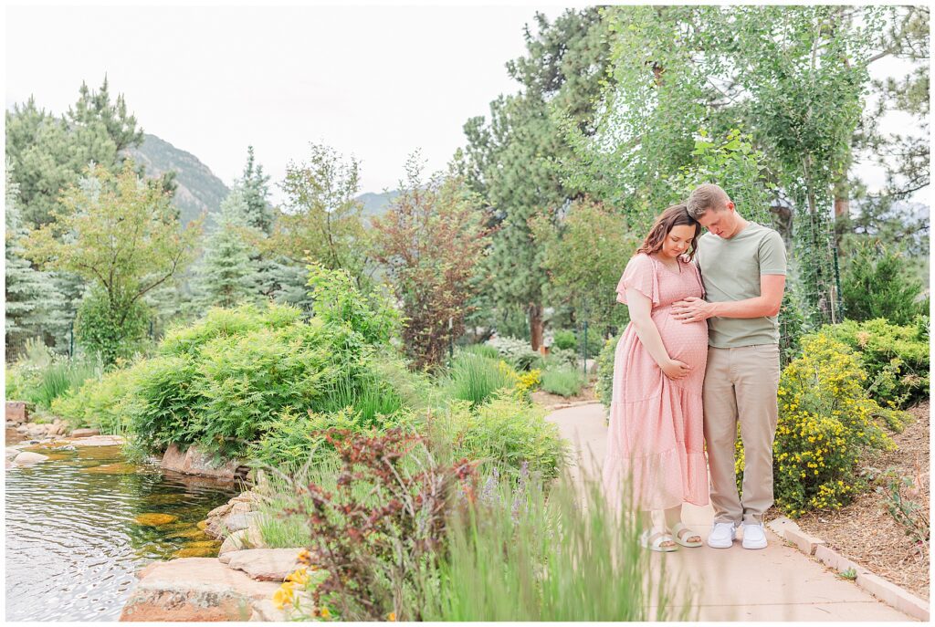 Couple pose for light and airy outdoor maternity photos with Catherine Chamberlain Photography in Northern Colorado