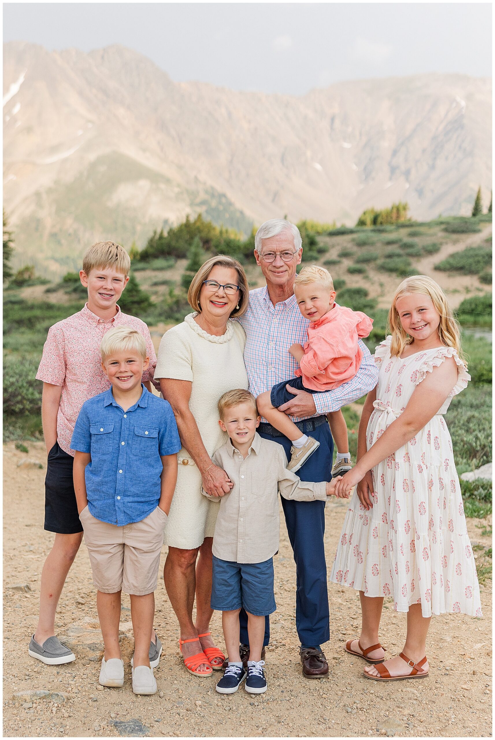 Grandparents pose with their grandkids outdoors for extended family photos in Colorado with Catherine Chamberlain Photography