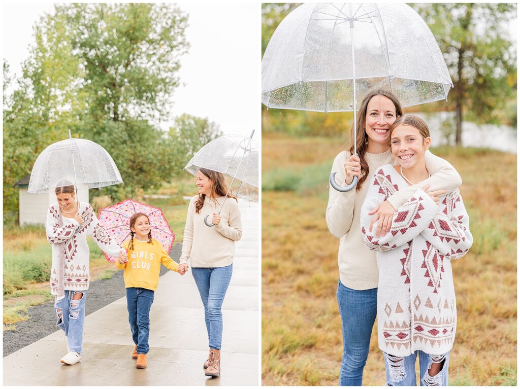 Mother and two daughters walk down a pathway during outdoor photos in the rain with umbrellas