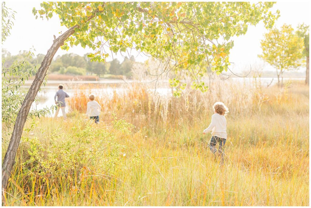 Kids wander down to the lake captured by family photographer Catherine Chamberlain of Colorado