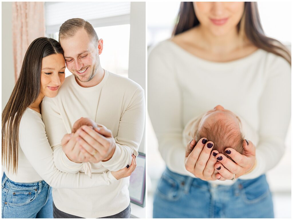 Family of three enjoy their newborn baby