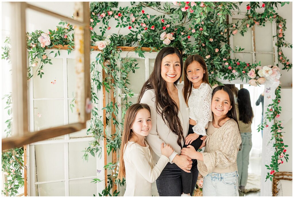 viral photo of mom and girls posing on a Valentine set with Catherine Chamberlain Photography based in Longmont, CO