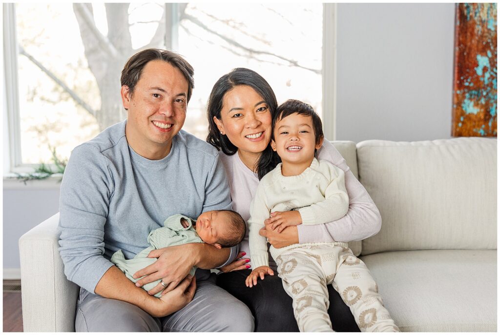 Family of four take newborn photos with family photographer Catherine Chamberlain of northern Colorado