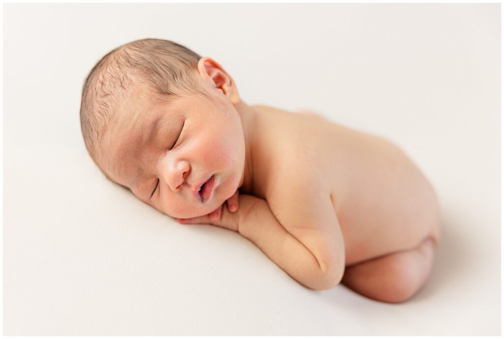 Light and airy newborn session with family photographer Catherine Chamberlain