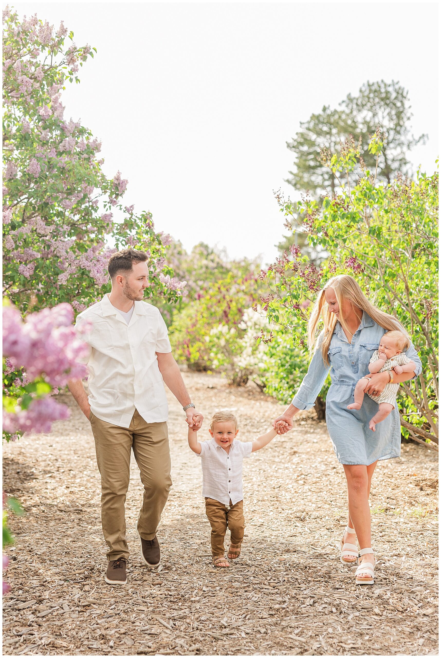 family of four poses for spring session with light and airy family photographer Catherine Chamberlain Photography out of Colorado