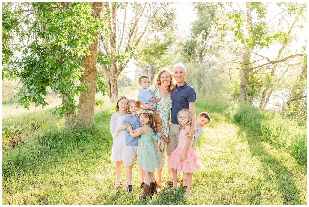 Grandparents take photo outside on their property with all their grandchildren in Longmont, CO Why Sales Feel Hard for Photographers (and It Has Nothing to Do With Your Personality)